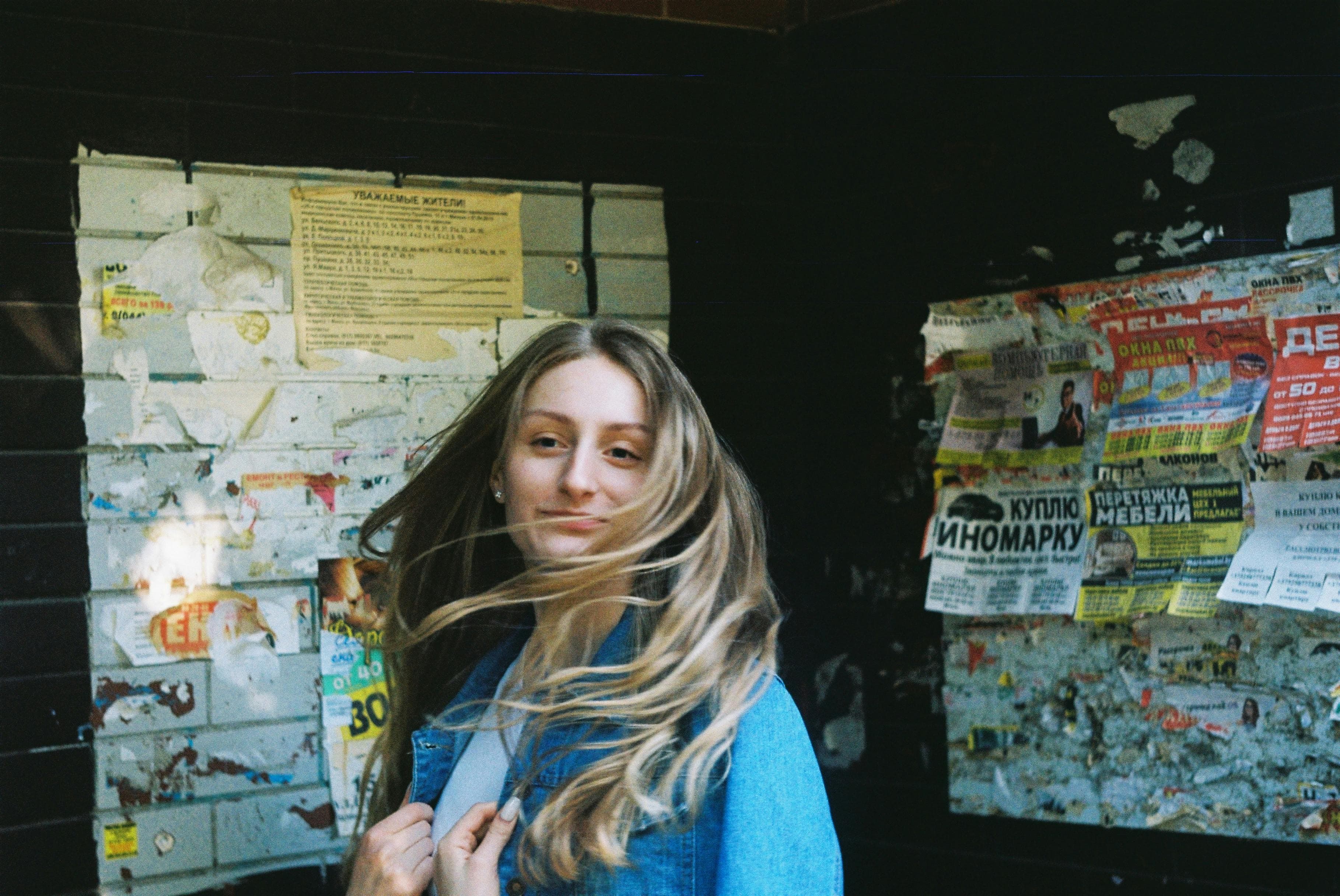 A woman in front of an event bulletin board