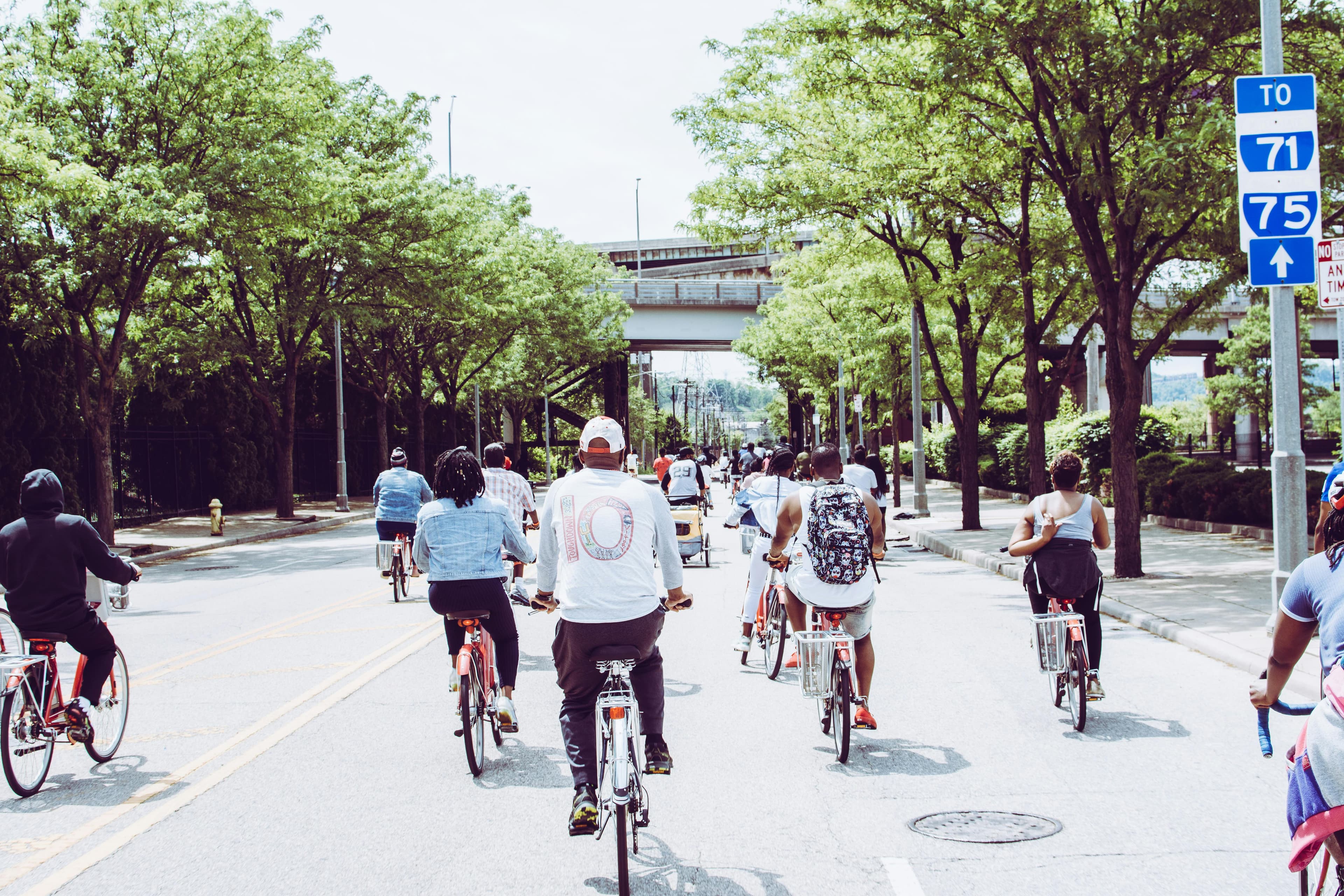 Group of people biking on the road.