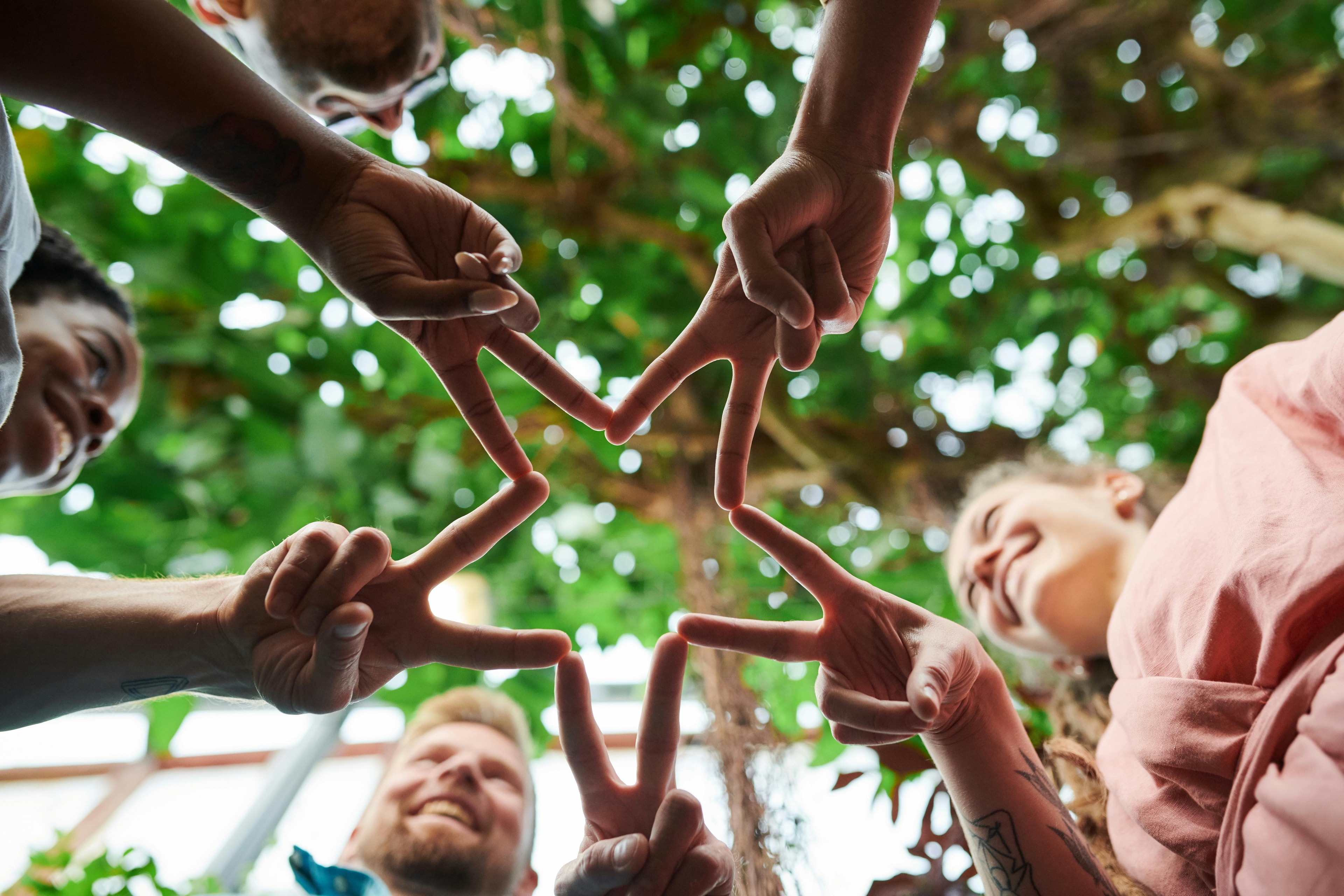 Friends making stars with their hands