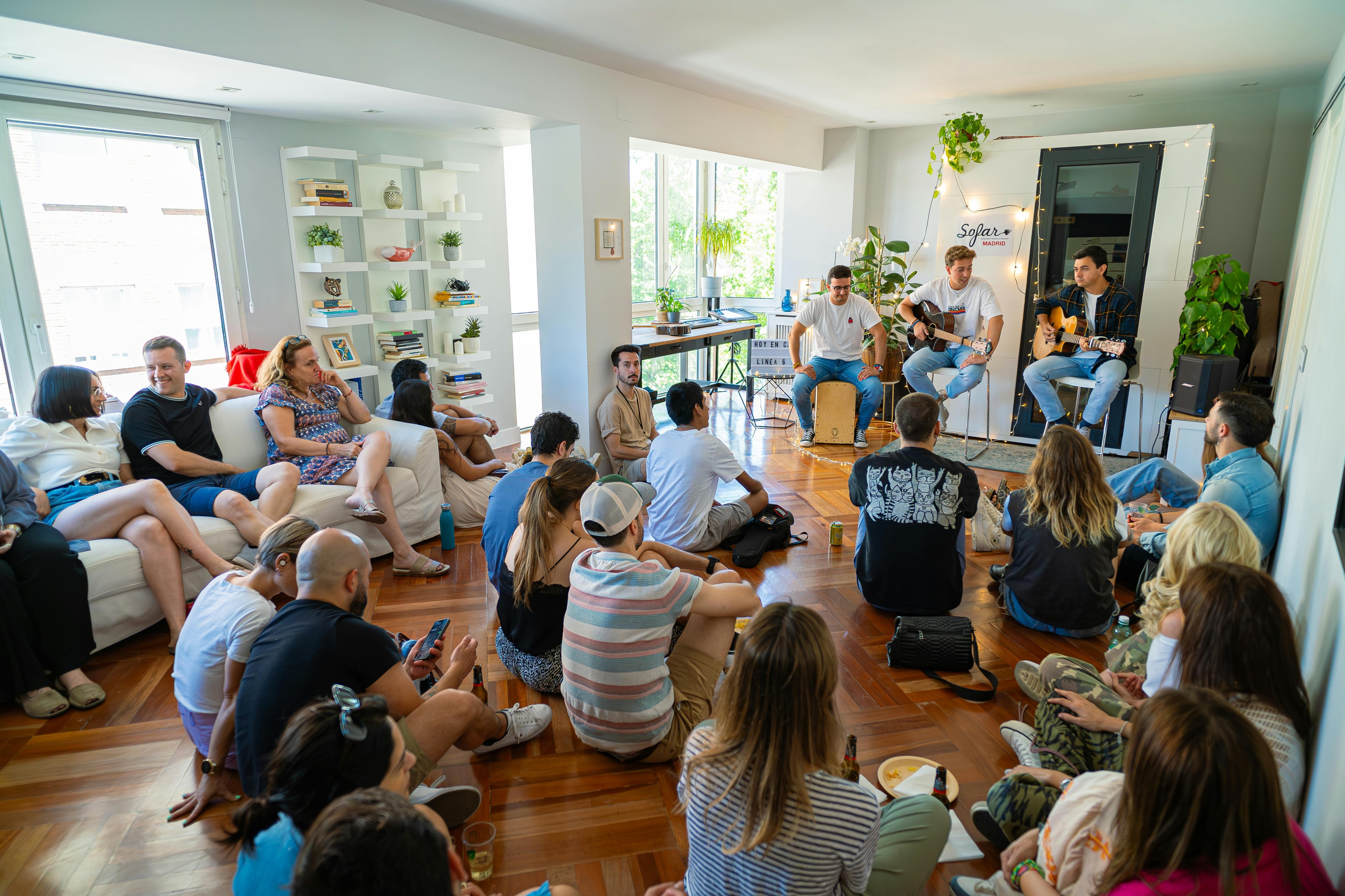 A group of people sitting listening to music