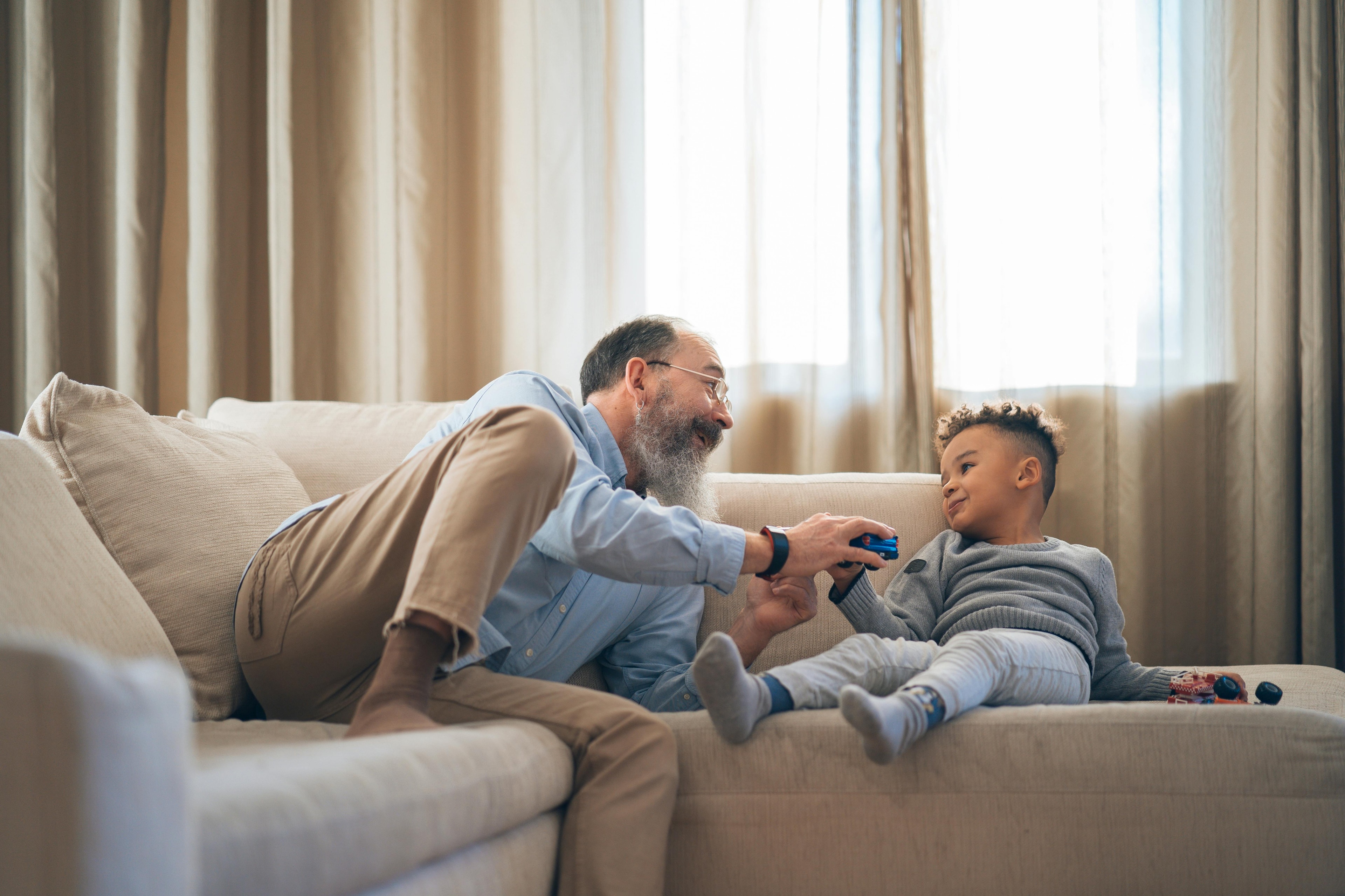 A grandparent interacts with child.