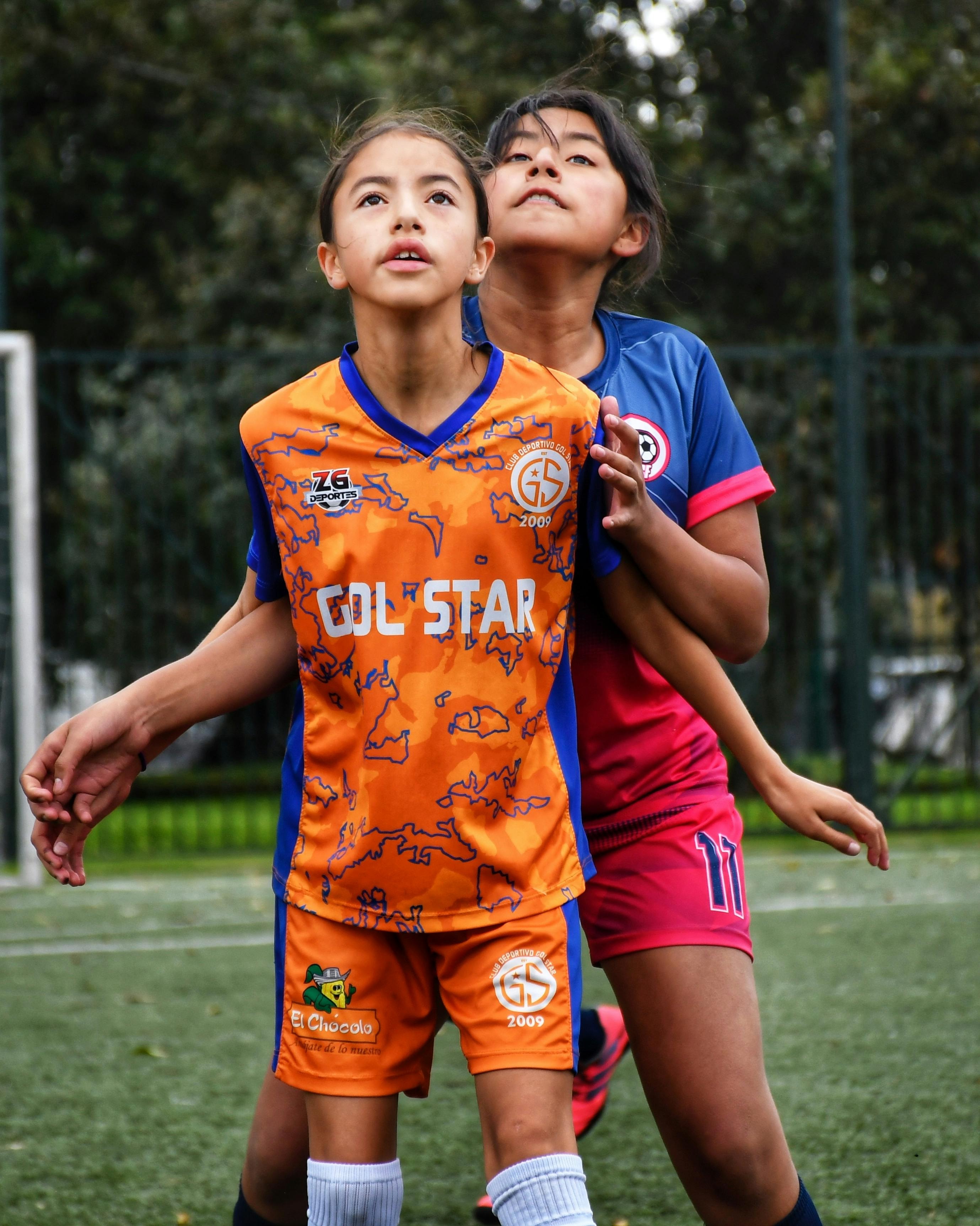 Two kids playing a sport